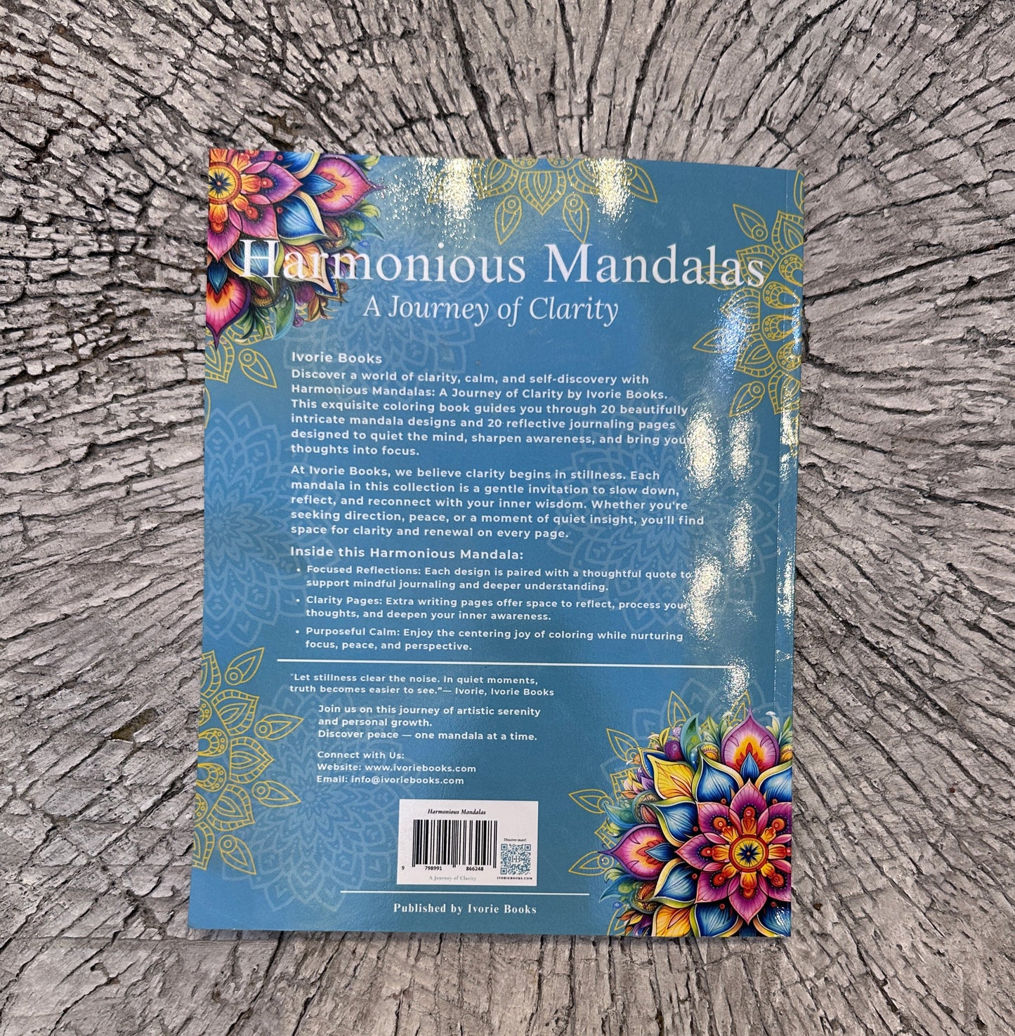 Paperback detail view of Harmonious Mandalas A Journey of Clarity coloring book. 
Paperback detail view of Harmonious Mandalas: A Journey of Clarity, showing the printed cover design and physical book quality.