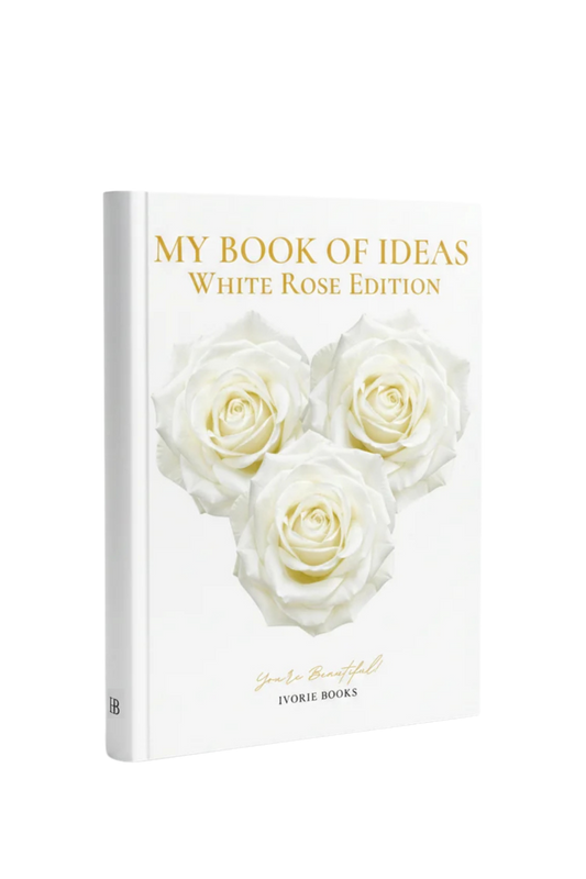 A hardcover book titled 'MY BOOK OF IDEAS White Rose Edition' with three white roses on the cover, photographed on a clean white background. The spine and cover show the brand name 'Ivorie Books'.