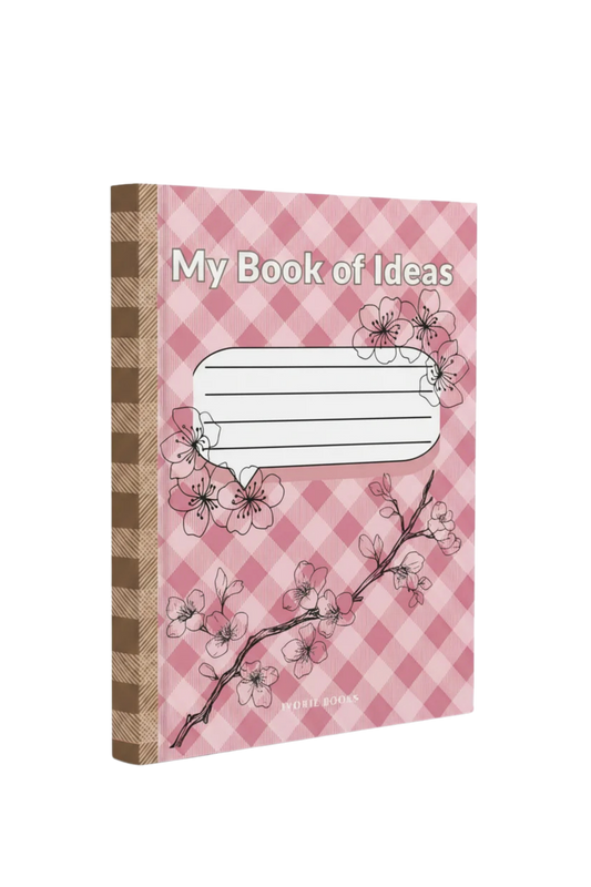 A notebook titled 'My Book of Ideas' with a pink and white checkered cover, decorated with cherry blossom illustrations, and a brown-and-beige plaid spine, shown on a plain white background.